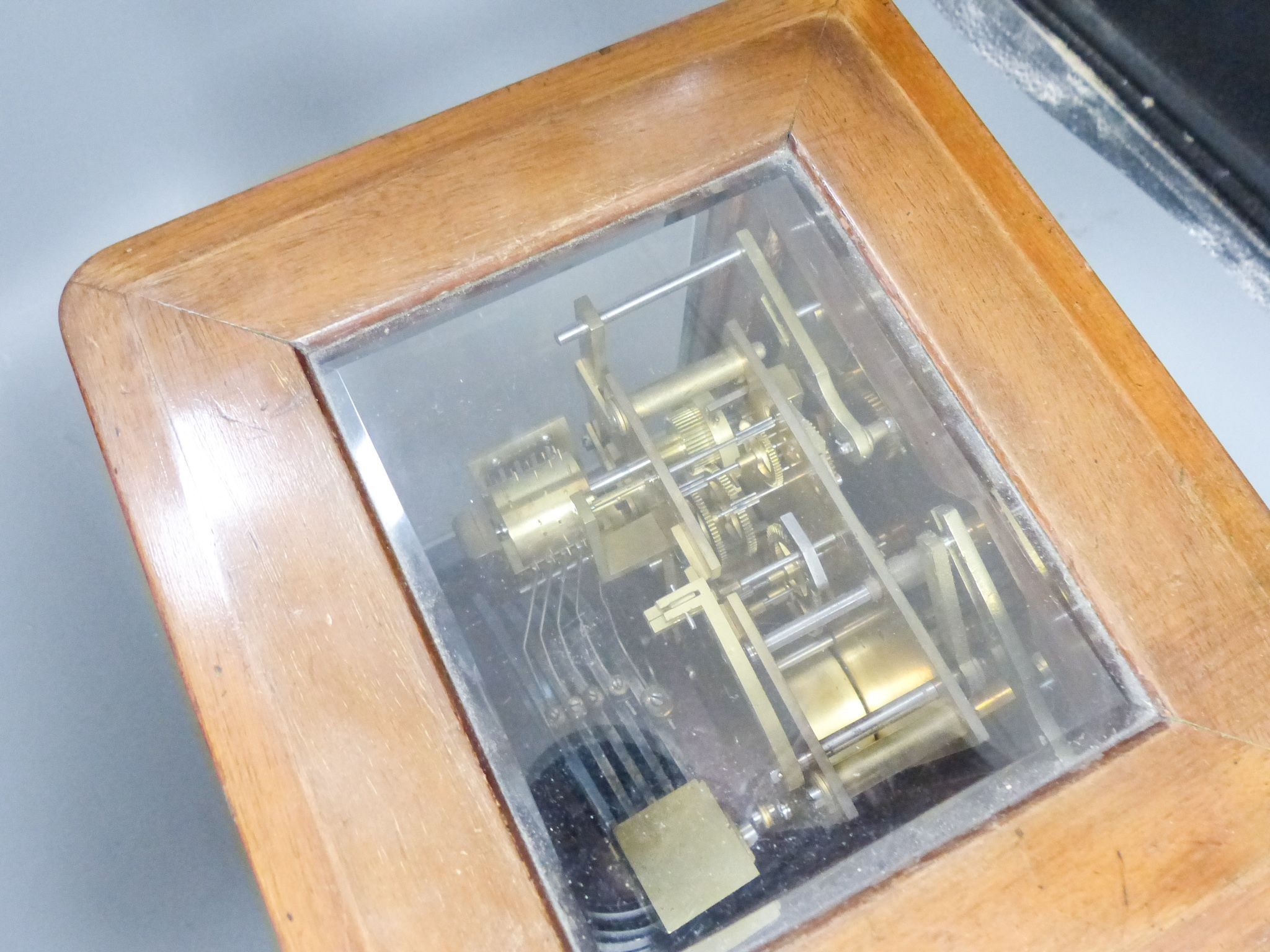 A chiming 4 glass mahogany mantel clock, retailed by Birch and Gaydon with silvered dial, 26.5 cm high 27cm